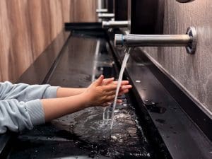 A touchless faucet to help elderly parent easily turn on and off faucet.