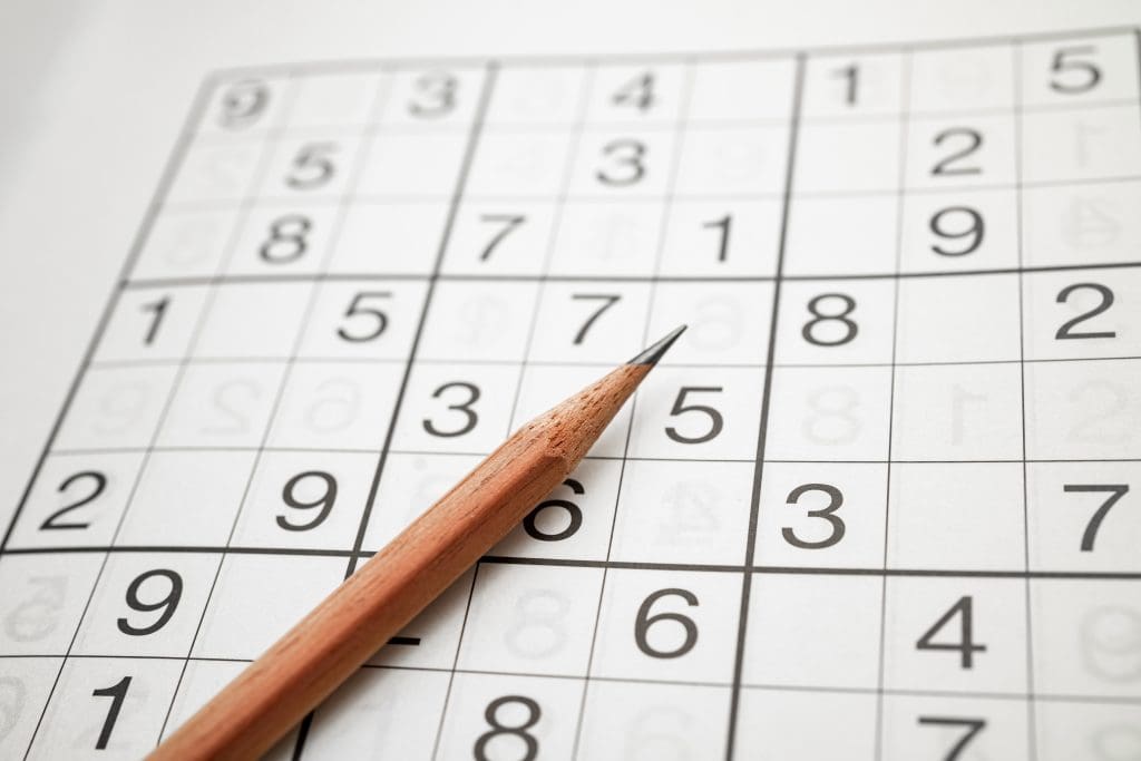 Sudoku puzzle and pencil