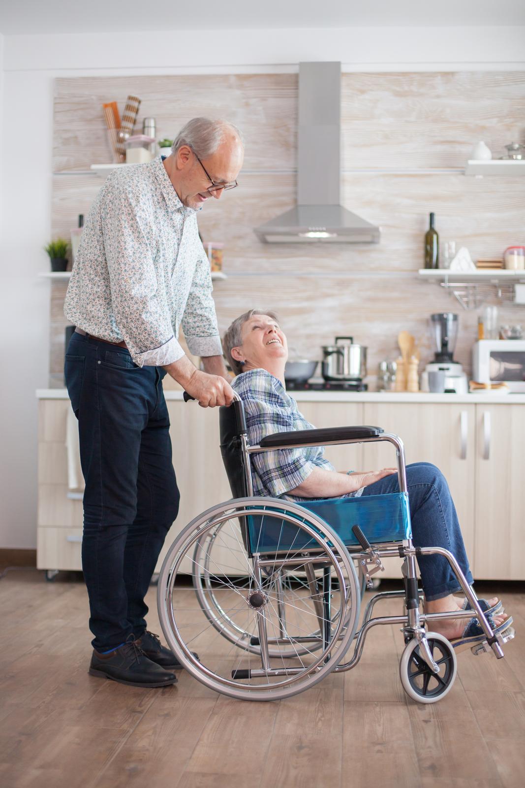 elderly husband caring for disabled wife