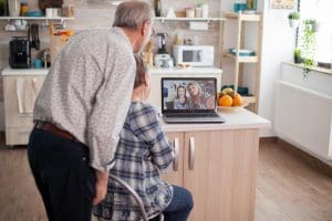 Senior couple visiting with family on video call