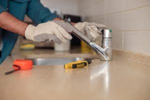 Plumber convert a faucet into a touchless faucet